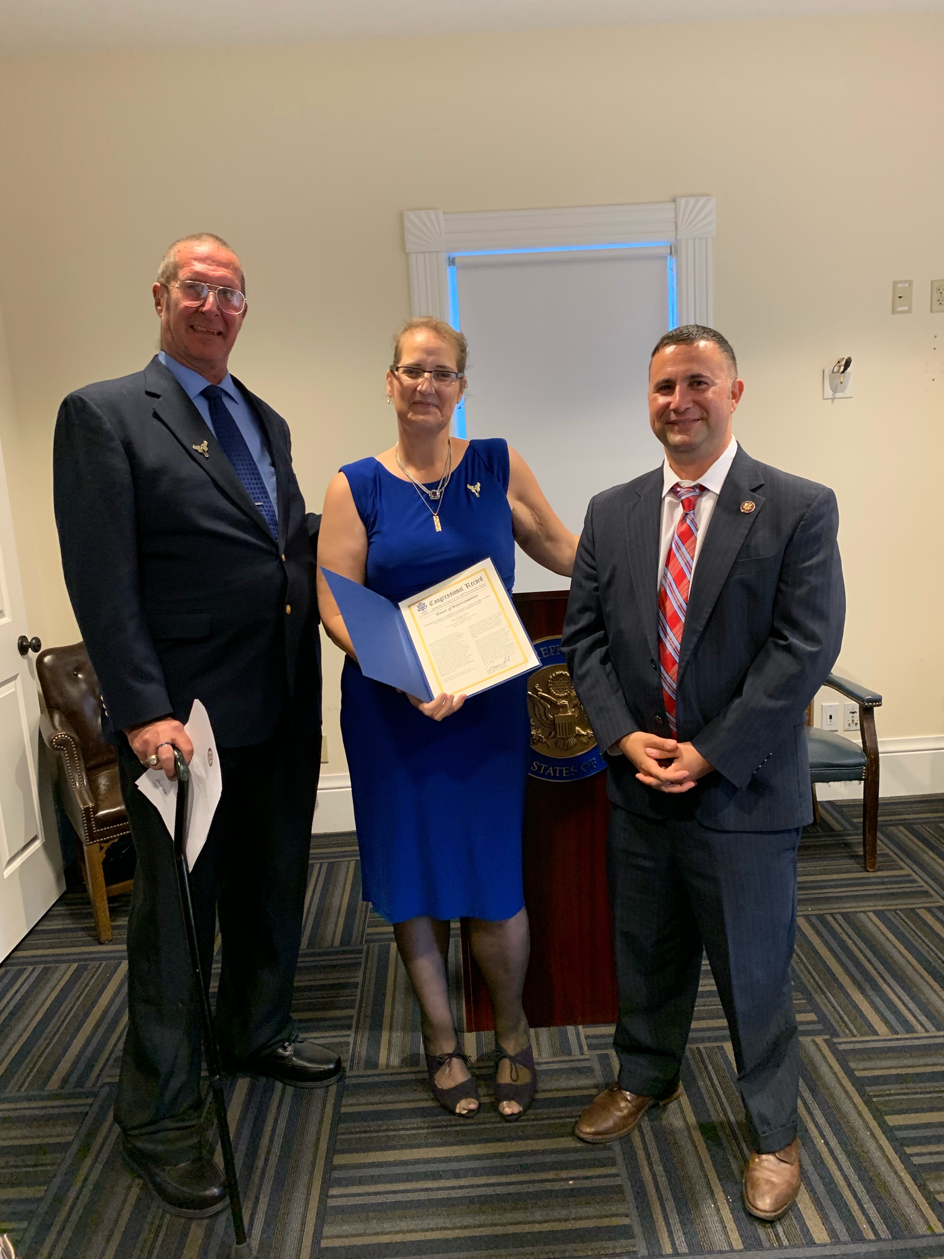Jeff (far left) with wife Christina, receiving a Congressional Honor