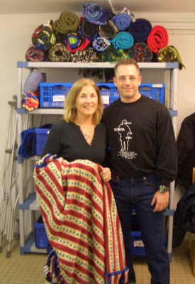 Soldiers' Angels volunteers in Germany distribute blankets to patients at Landstuhl