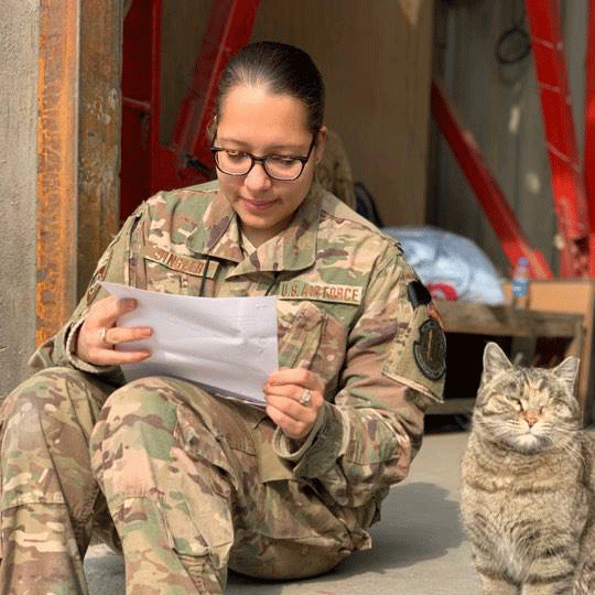 Nilami, a real deployed Service Member, reading a letter from out Letter Writing Team.
