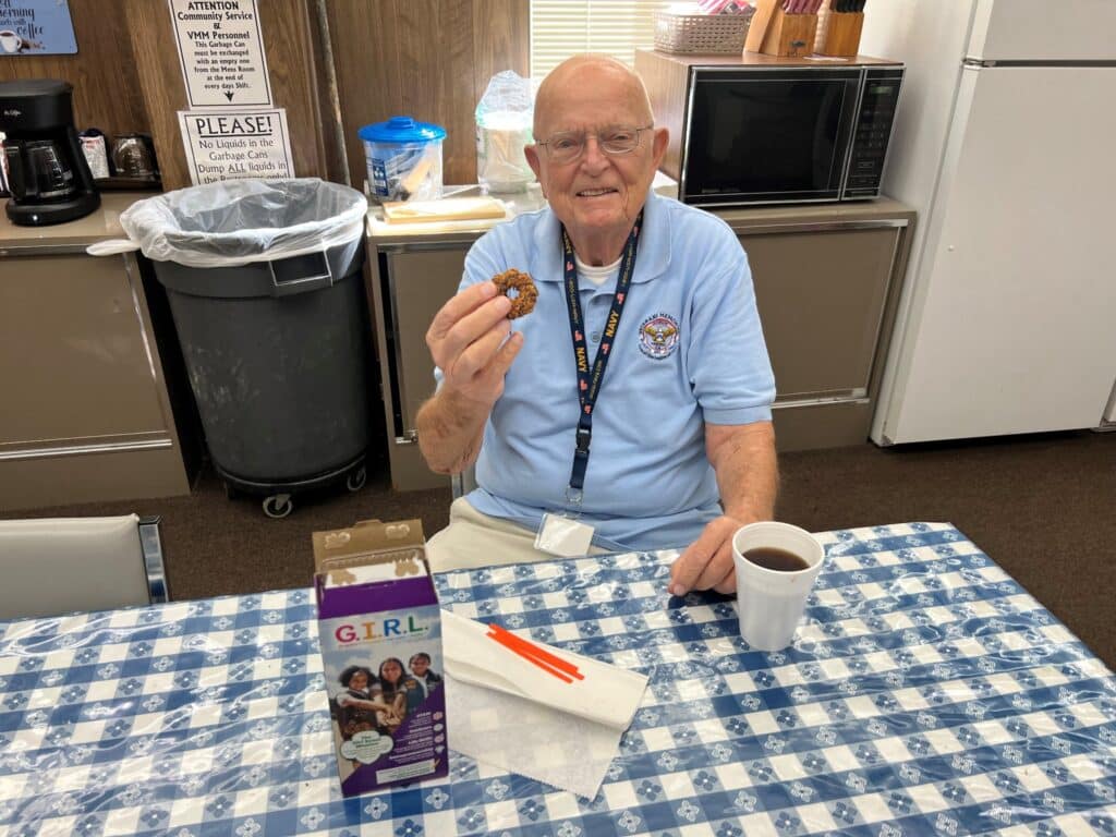 Veteran eating a girl scout cookie