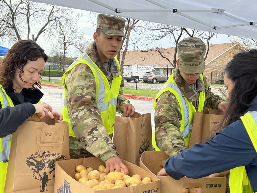 Active duty Service Members often come to volunteer at food distributions.