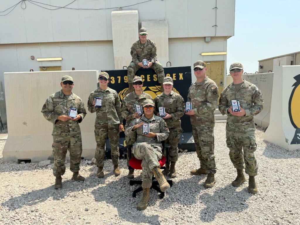 A deployed unit excited to receive their Coffee for the Troops care packages.